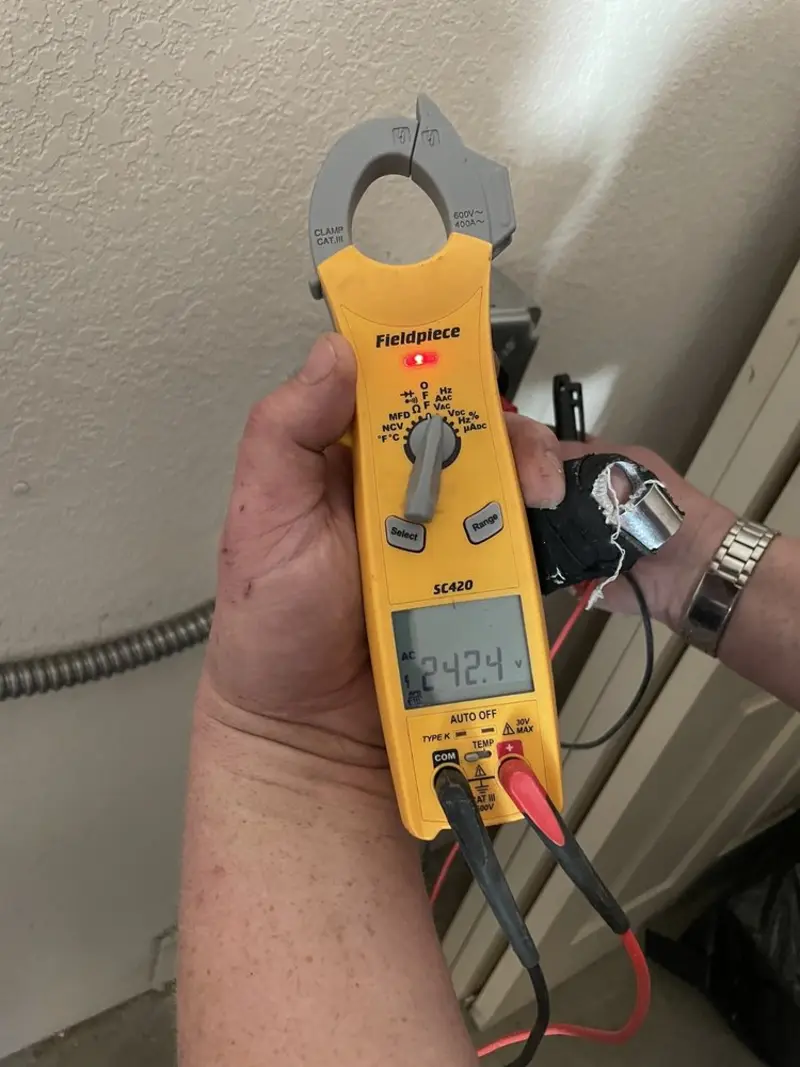 Voltage testing with clamp meter during Circuit Breaker Repair in Pecan Acres